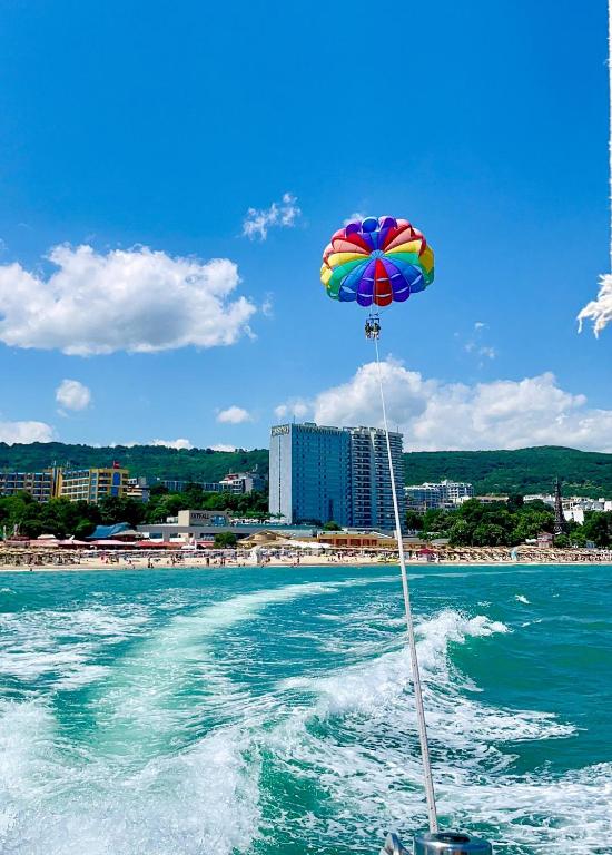 a colorful umbrella on the back of a boat in the water at International Hotel Casino & Tower Suites in Golden Sands