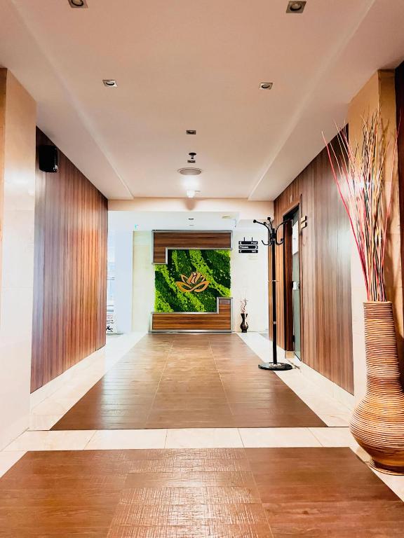 a hallway with a large painting on the wall at International Hotel Casino & Tower Suites in Golden Sands