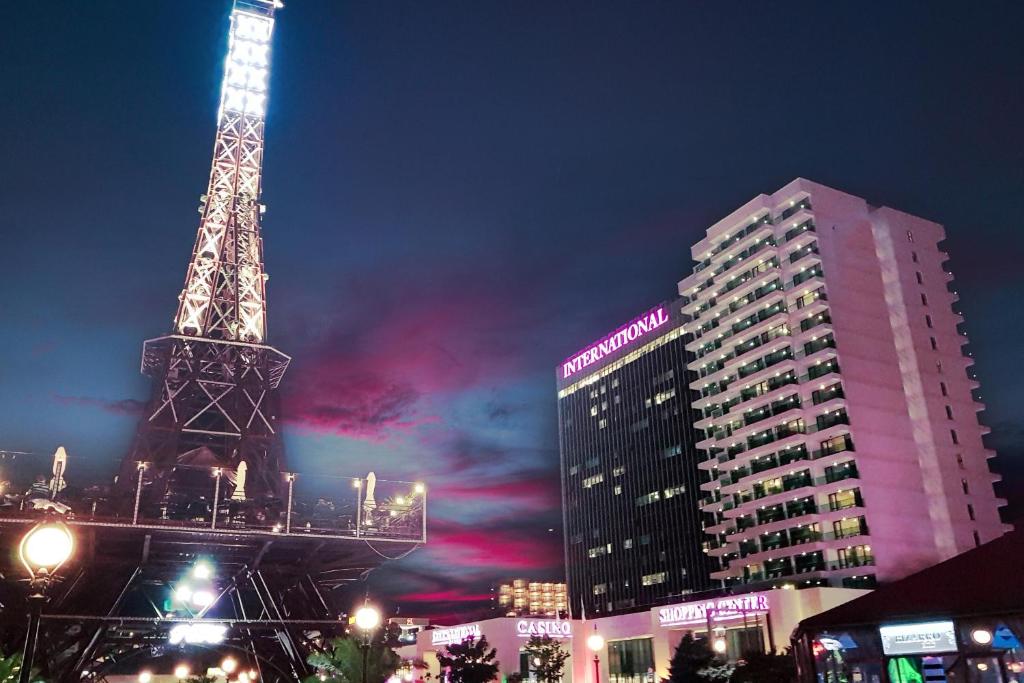 a view of the eiffel tower at night at International Hotel Casino & Tower Suites in Golden Sands