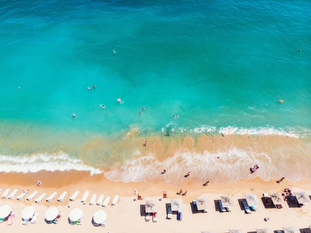 an aerial view of a beach with chairs and the ocean at International Hotel Casino & Tower Suites in Golden Sands