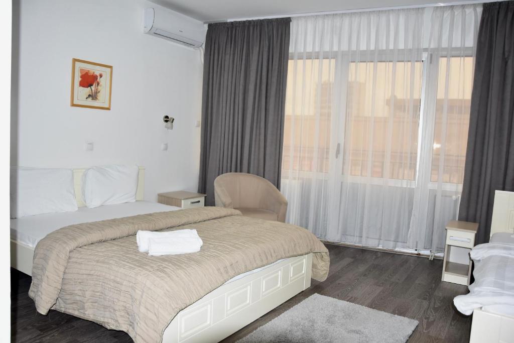 Letto o letti in una camera di Garni Hotel Hamburg