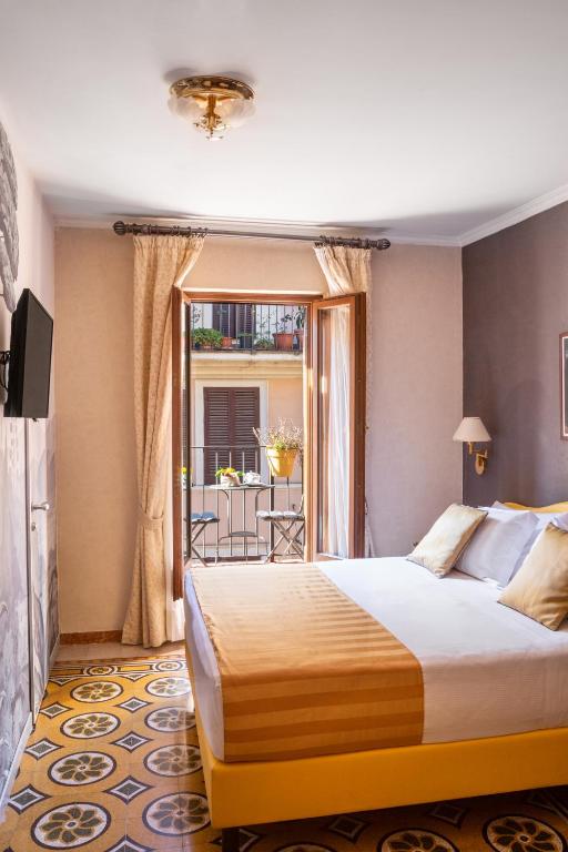Postel nebo postele na pokoji v ubytování Hotel Piazza Di Spagna