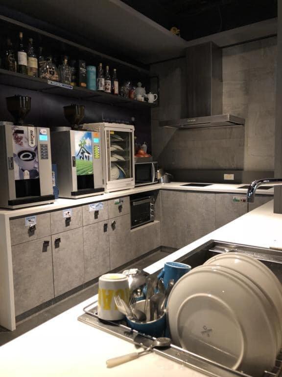 a kitchen with a sink and a counter top at Taipei Discover Hostel in Taipei