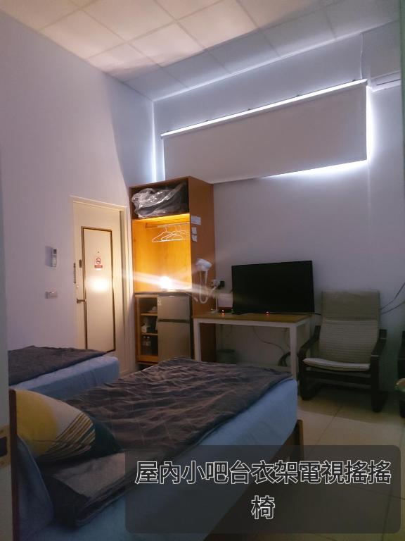 Postel nebo postele na pokoji v ubytování 南田旅宿