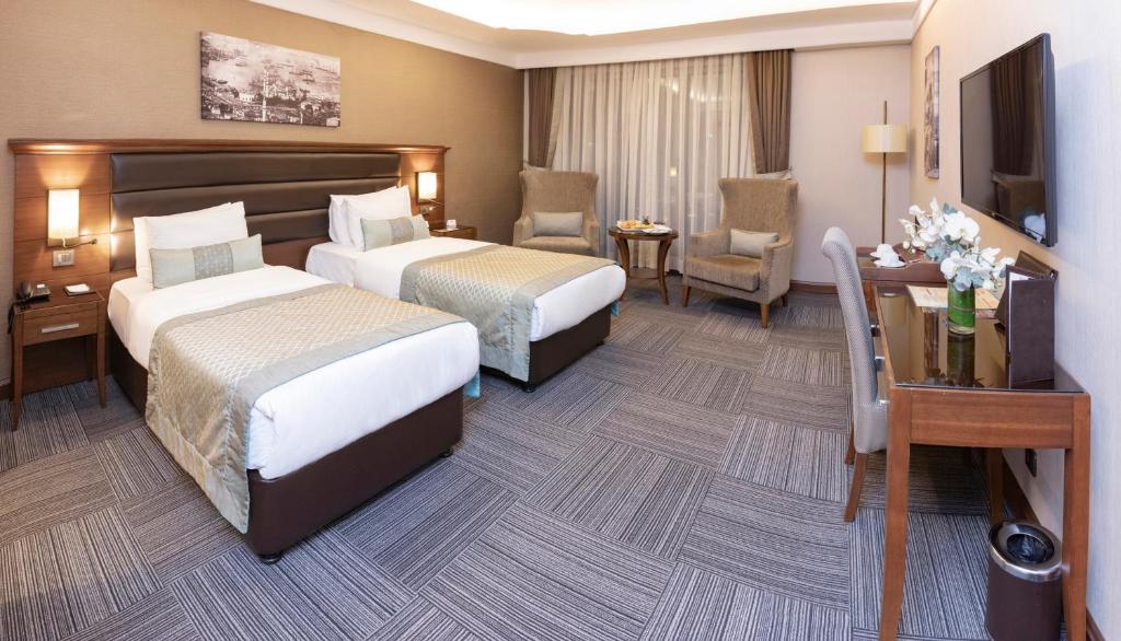 Postel nebo postele na pokoji v ubytování Grand Makel Hotel Topkapi