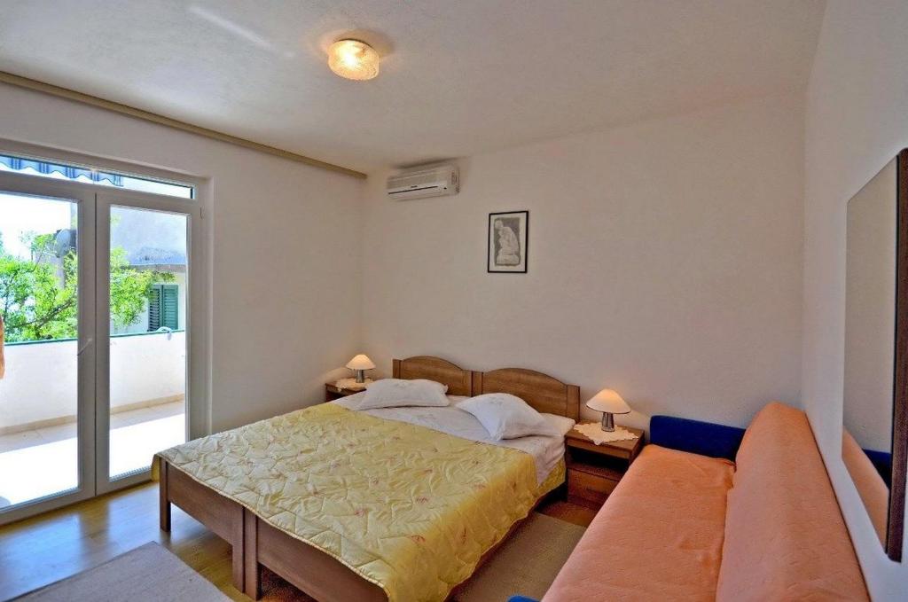 Posteľ alebo postele v izbe v ubytovaní Apartments and Room Marin