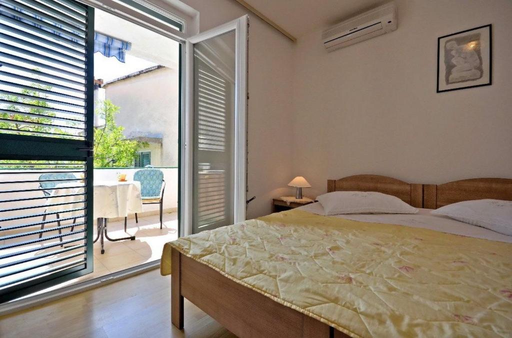 Posteľ alebo postele v izbe v ubytovaní Apartments and Room Marin