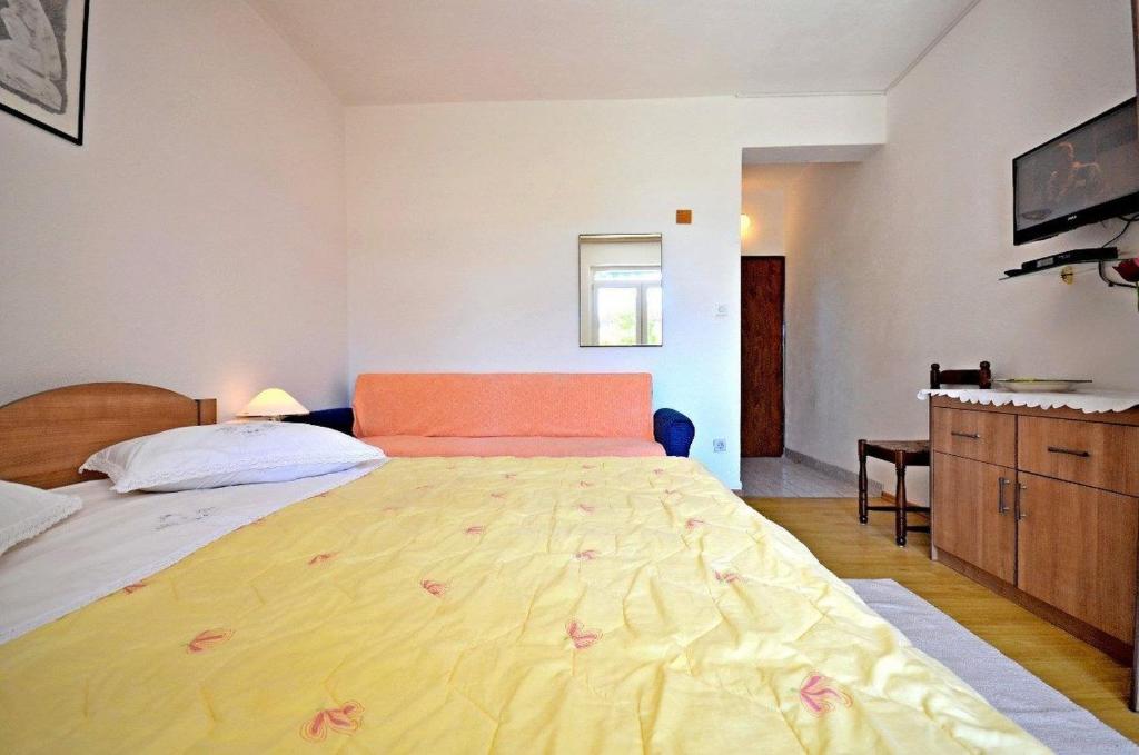 Posteľ alebo postele v izbe v ubytovaní Apartments and Room Marin