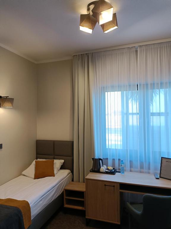 Posteľ alebo postele v izbe v ubytovaní Leśne Niebo
