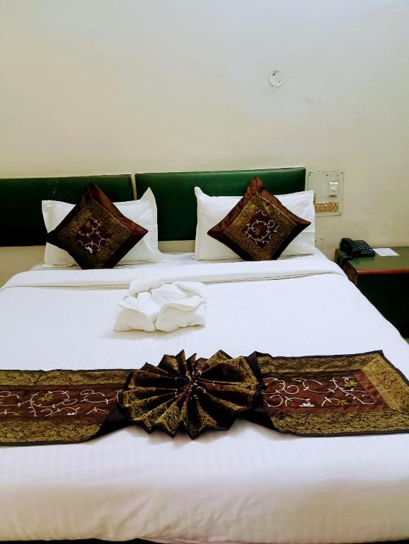 Voodi või voodid majutusasutuse Hotel Ranjit Residency toas