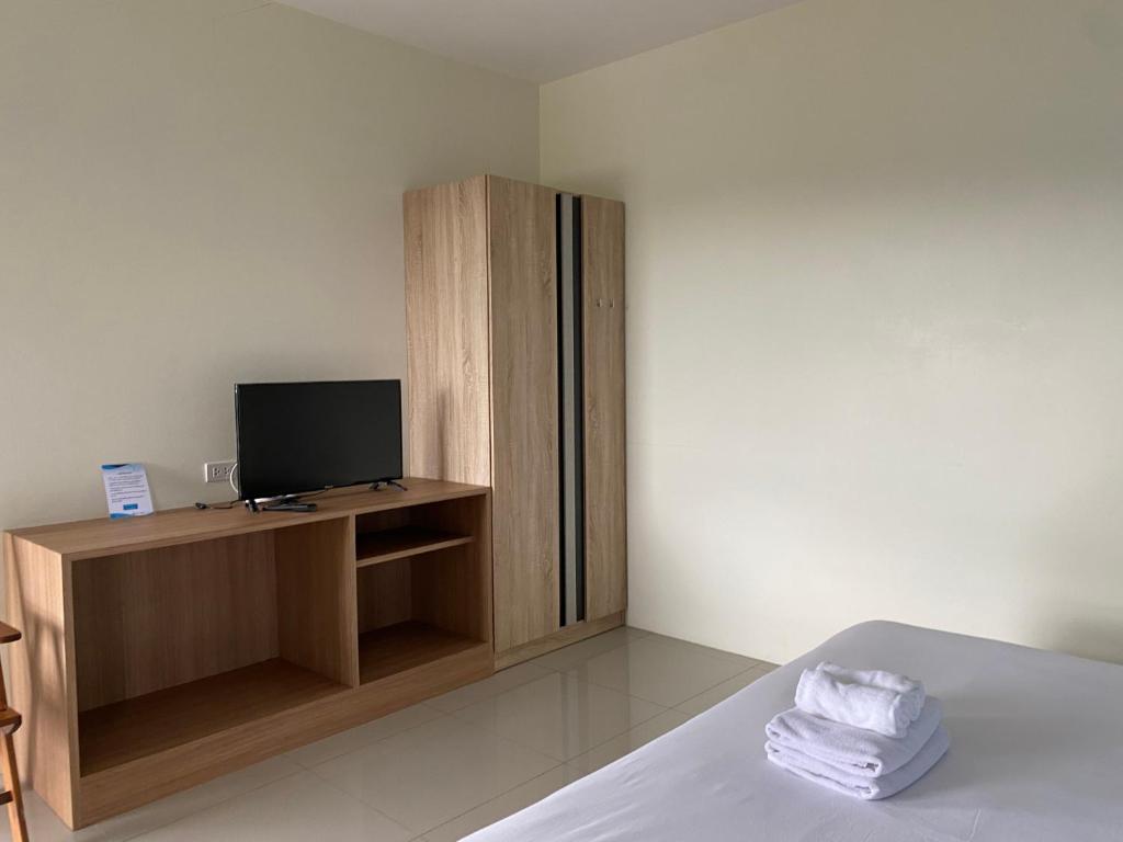Postel nebo postele na pokoji v ubytování Tha-ruea Residence