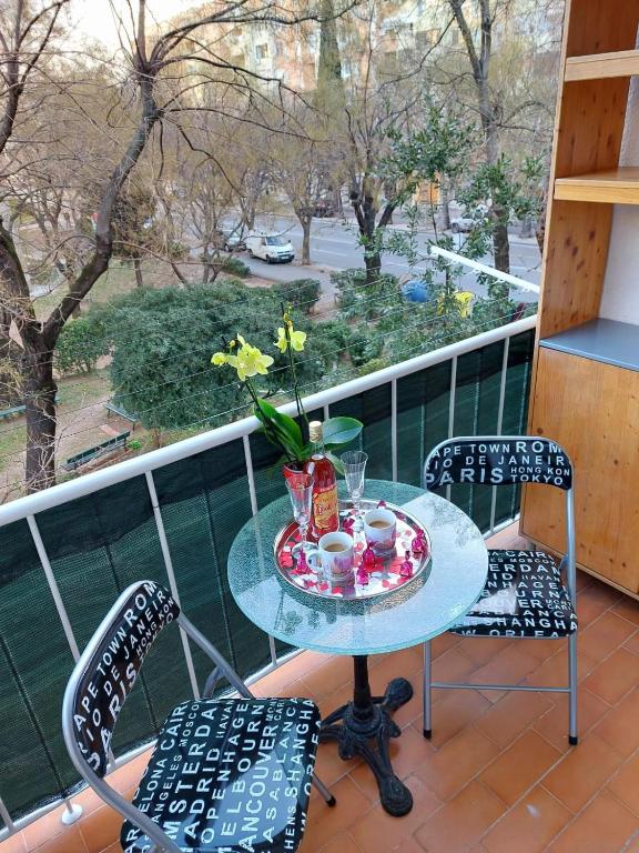 a table and two chairs on a balcony at Split apartment in Split