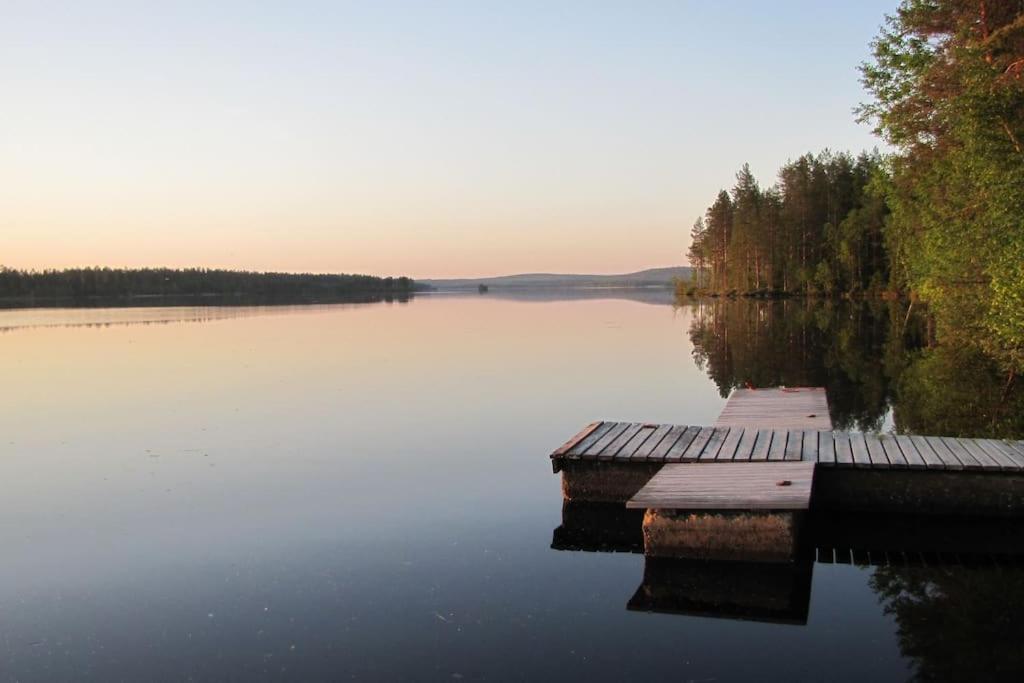 a dock in the middle of a large lake at RELAX, Heart of nature and lakes in Hyrynsalmi