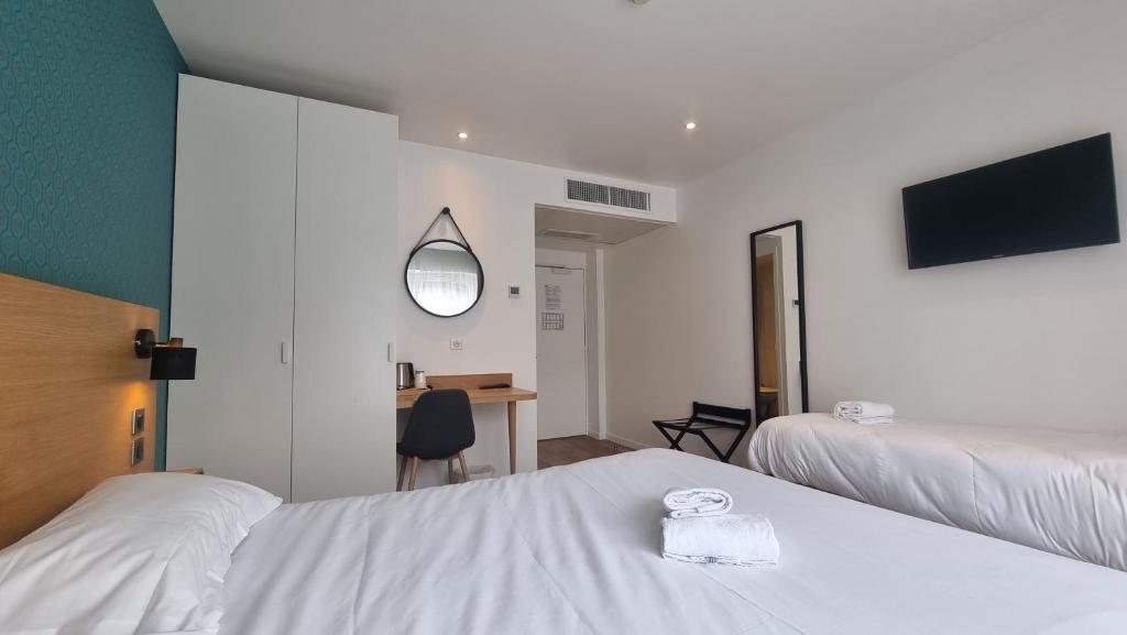 Postel nebo postele na pokoji v ubytování Oskar Hotel