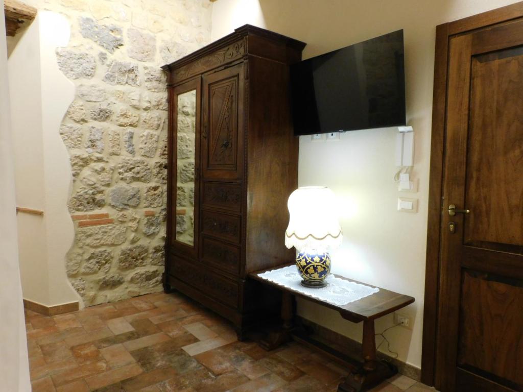 TV a/nebo společenská místnost v ubytování Sognare nel Castello