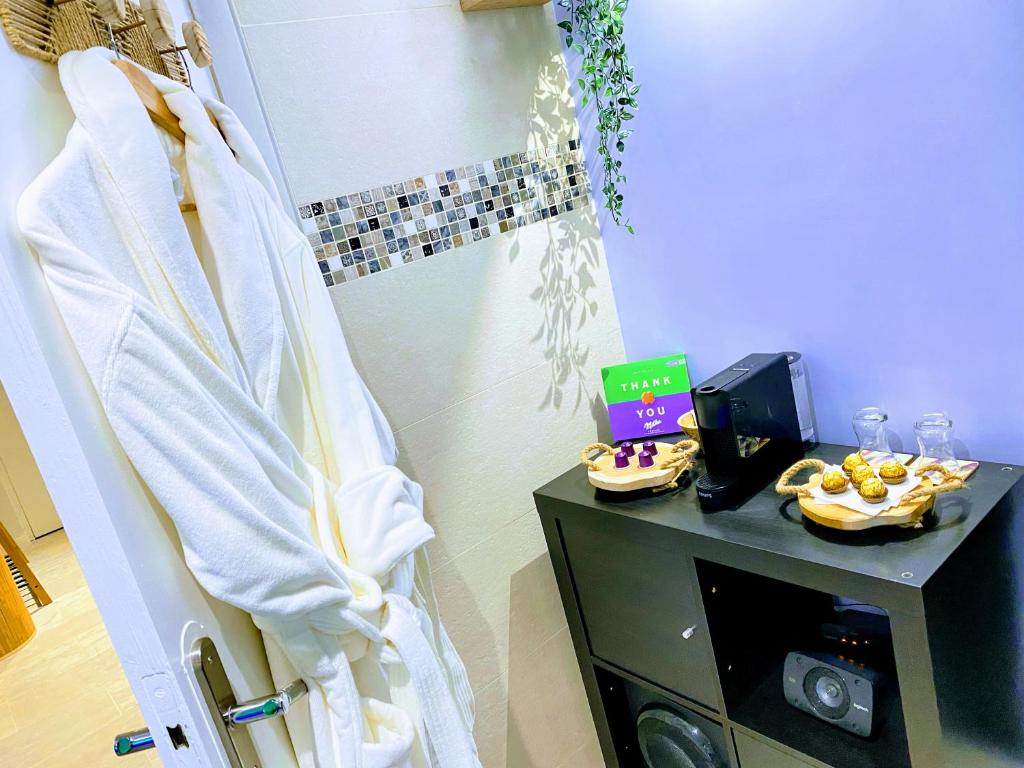 a bathroom with a shower with a plate of food at BIOTY CHILL &amp; SPA in Le Blanc-Mesnil