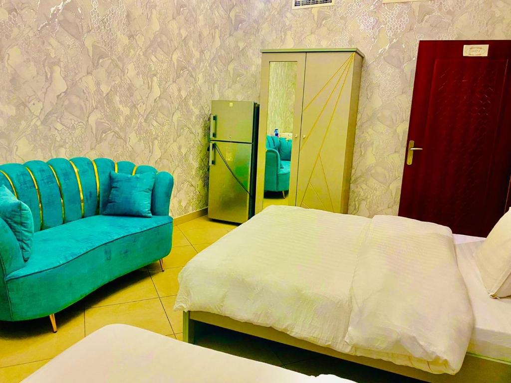 Postel nebo postele na pokoji v ubytování Jin Jie Residence