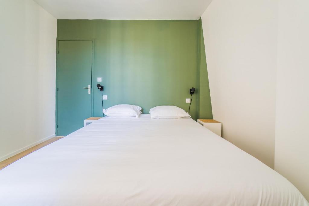 Posteľ alebo postele v izbe v ubytovaní Logis Cosy sur la Guierle - 1 Chambre