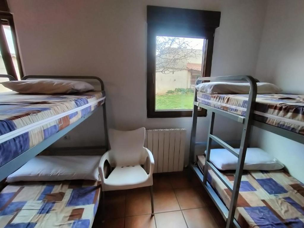 Postel nebo postele na pokoji v ubytování Albergue Don Camino