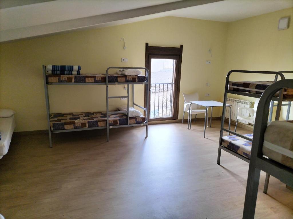 Postel nebo postele na pokoji v ubytování Albergue Don Camino