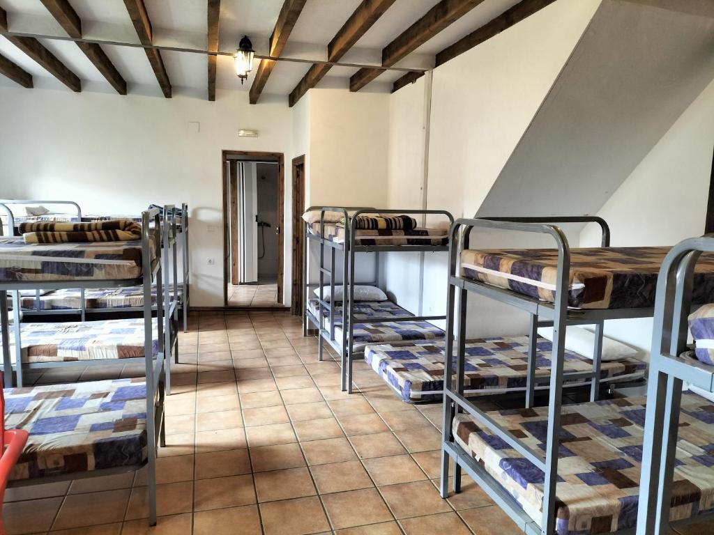 Postel nebo postele na pokoji v ubytování Albergue Don Camino
