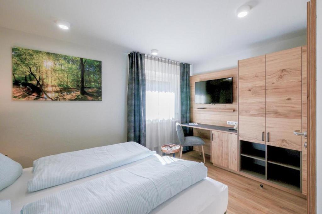 Postel nebo postele na pokoji v ubytování Landhotel Zum Jägerstöckl