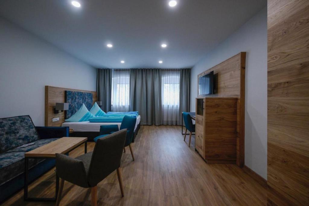 Postel nebo postele na pokoji v ubytování Landhotel Zum Jägerstöckl