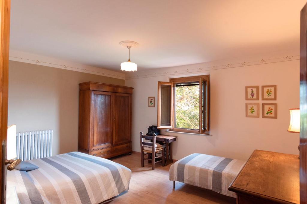 Postel nebo postele na pokoji v ubytování Agriturismo La Pineta