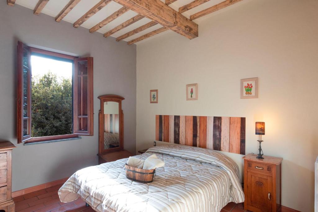 Postel nebo postele na pokoji v ubytování Agriturismo La Pineta