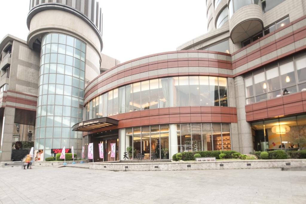 a large building with a lot of windows at Beitou Hot Spring Resort in Taipei