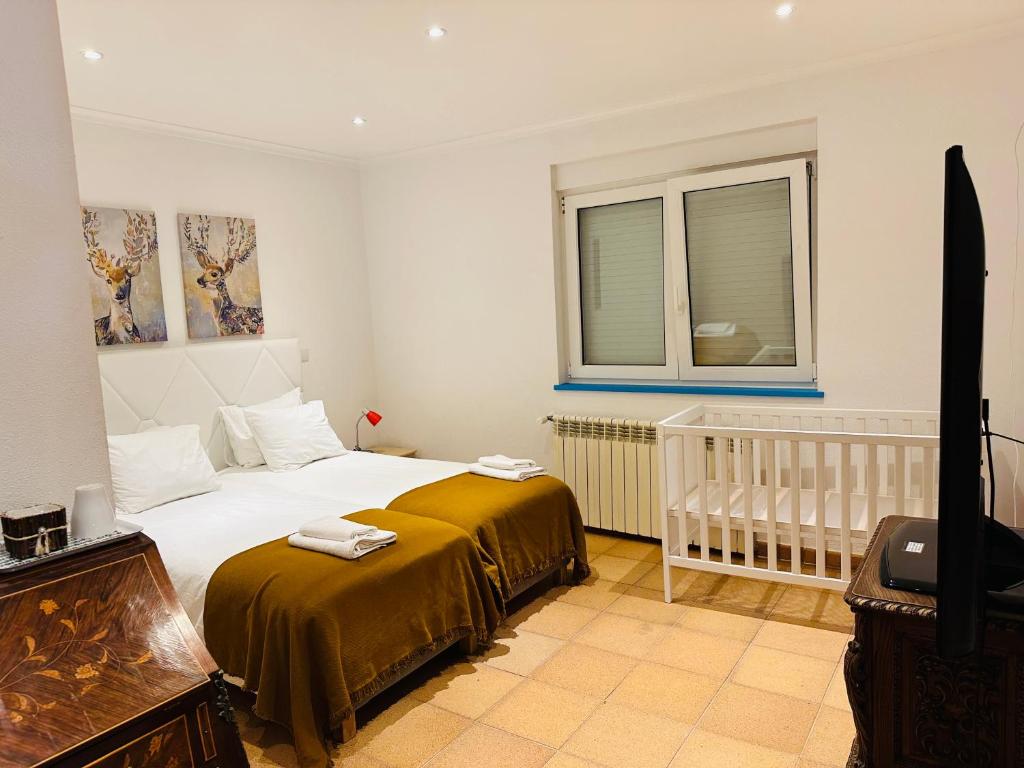 Cama ou camas em um quarto em Mega Ocean Magoito - Sintra