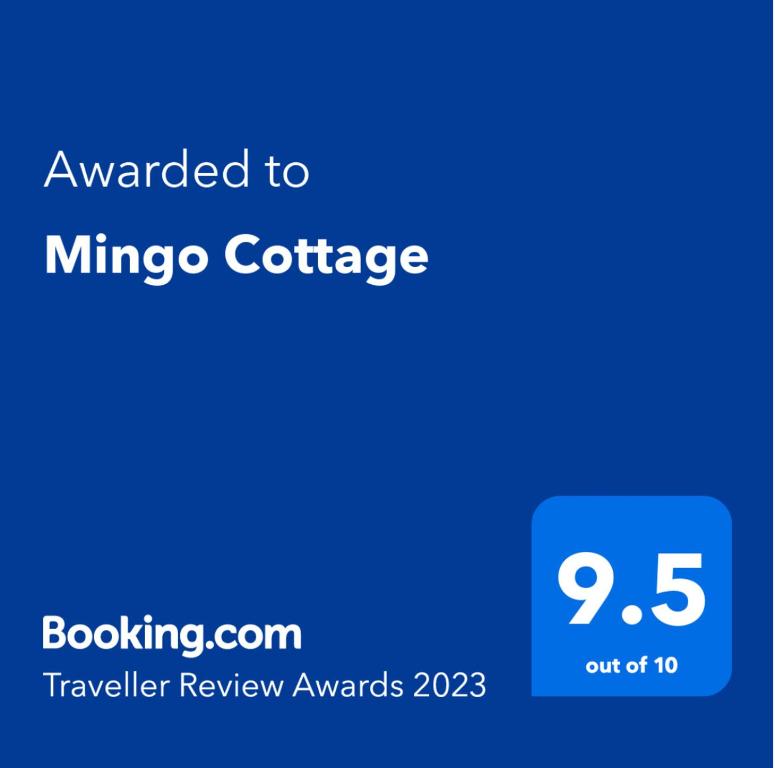 a blue screen with the text awarded to mineico conference at Mingo Cottage in Bewdley