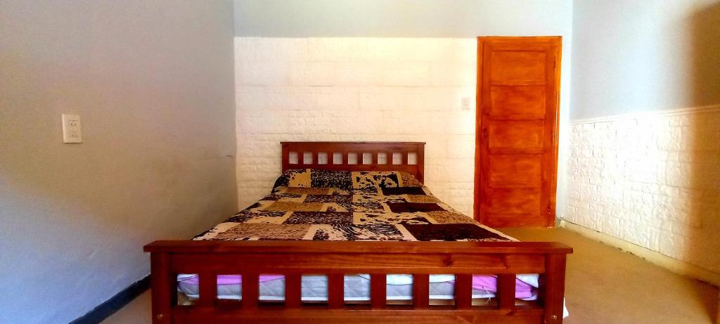 Una cama o camas en una habitación de Hostel Paraíso
