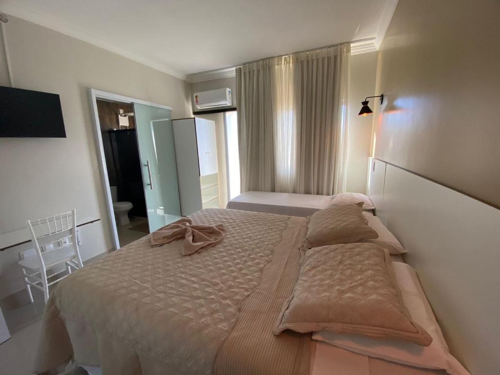 Postel nebo postele na pokoji v ubytování Faixa Hotel