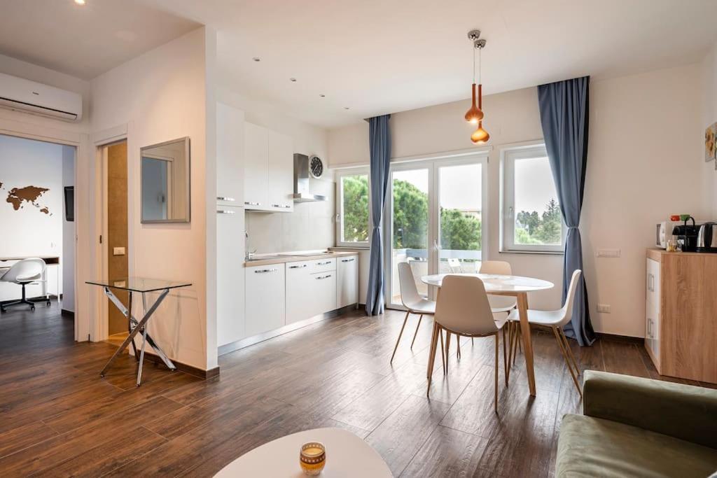 a living room with a table and a kitchen at Soul Apartment in Rome, Vatican Museum in Rome