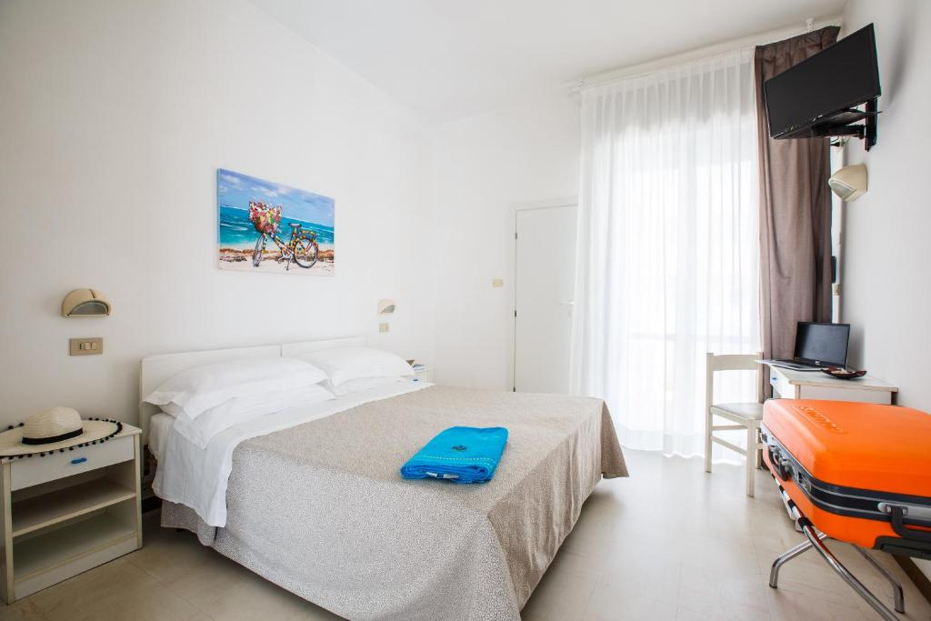 Postel nebo postele na pokoji v ubytování Hotel Capinera