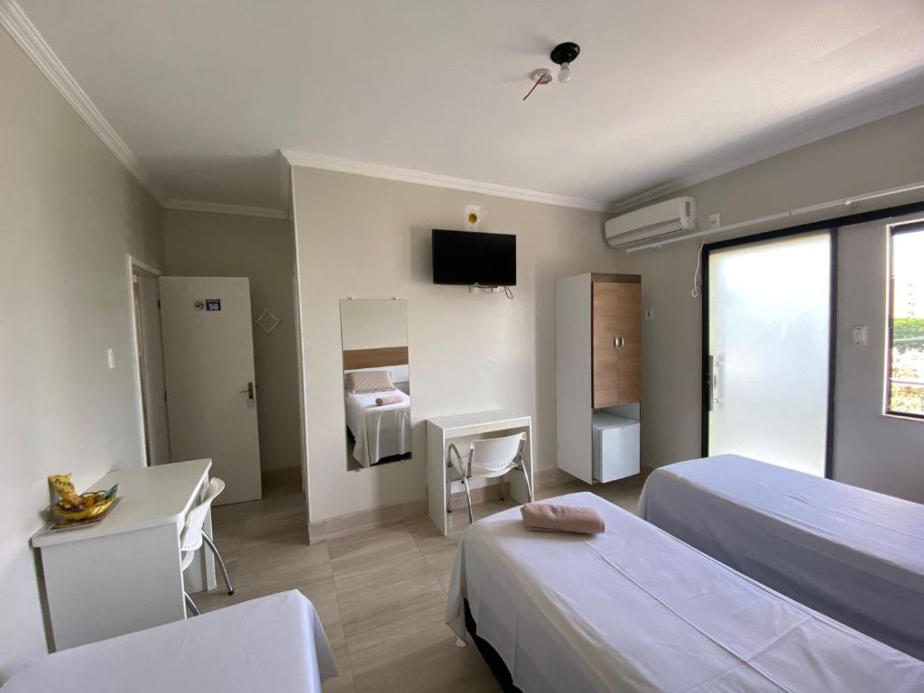 Postel nebo postele na pokoji v ubytování Faixa Hotel