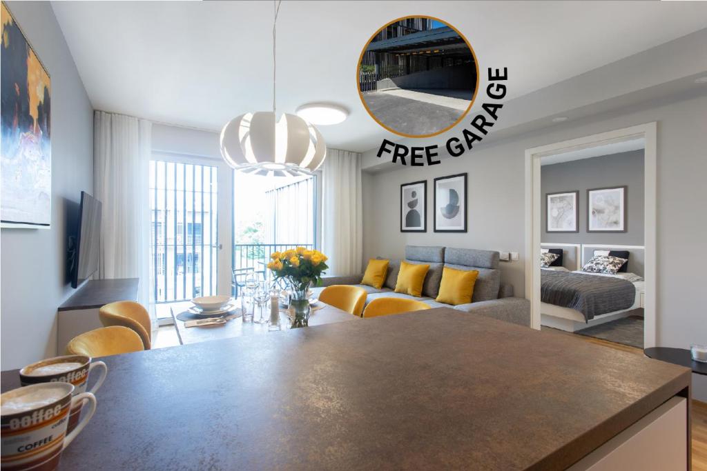 a kitchen and living room with a table and a mirror at Apartments Poklukar Bled in Bled