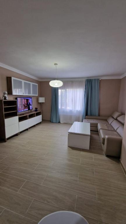 a large living room with a couch and a tv at CASA LORY in Playa Blanca