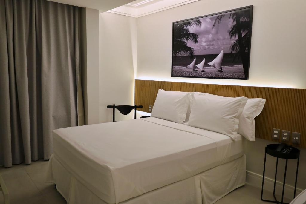 Voodi või voodid majutusasutuse Tintto Hotel toas
