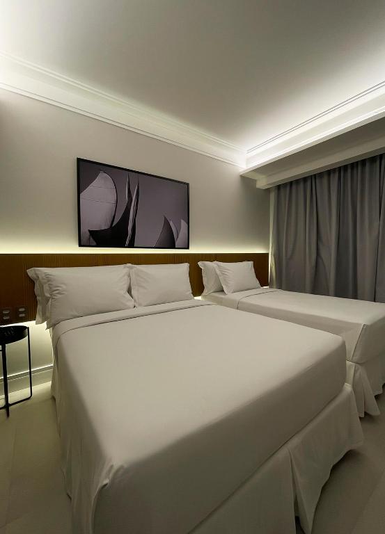 Voodi või voodid majutusasutuse Tintto Hotel toas