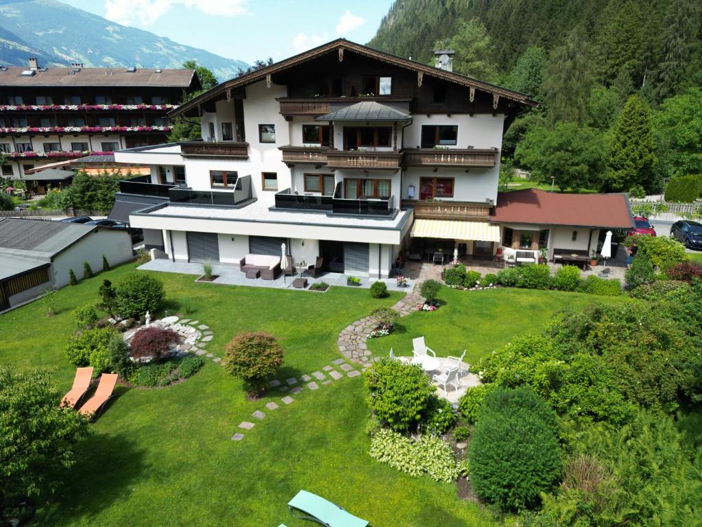 an aerial view of a house with a garden at Hotel Garni Erler in Mayrhofen