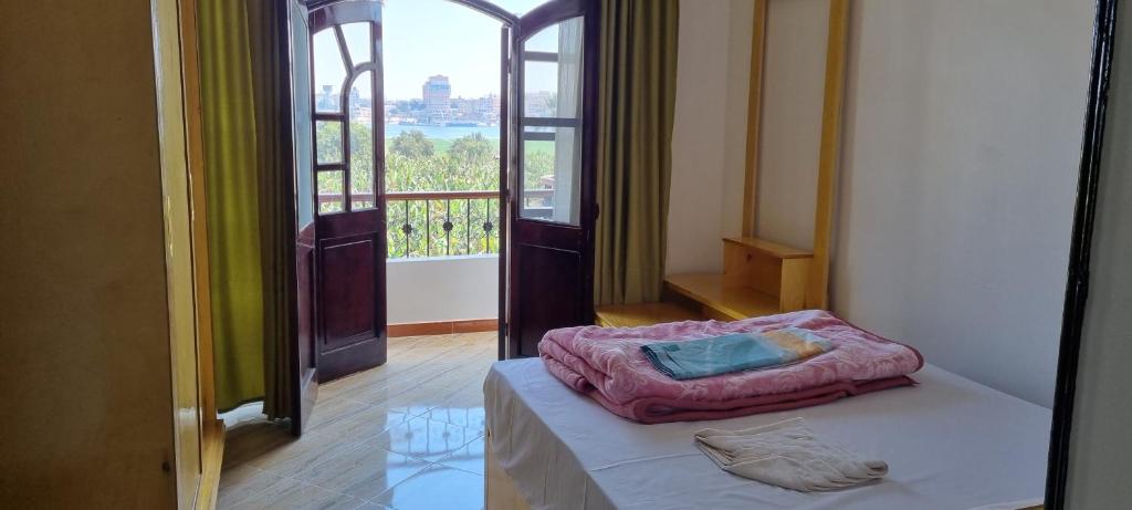 Postel nebo postele na pokoji v ubytování DREAM ISLAND Hotel