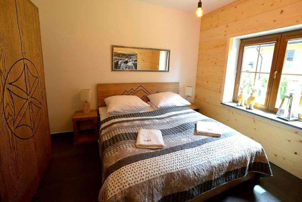 Posteľ alebo postele v izbe v ubytovaní Exclusive apartment with sauna and garden on the Czorsztyn lake