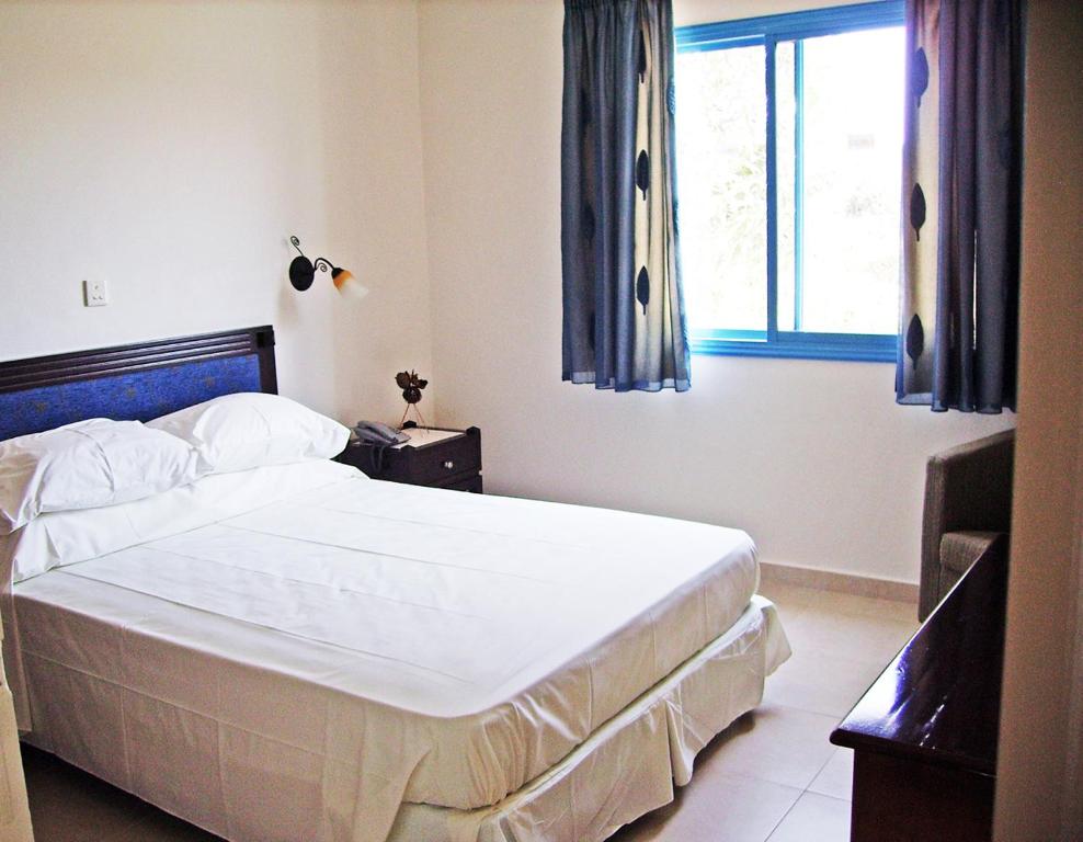 Postel nebo postele na pokoji v ubytování Tasmaria Aparthotel