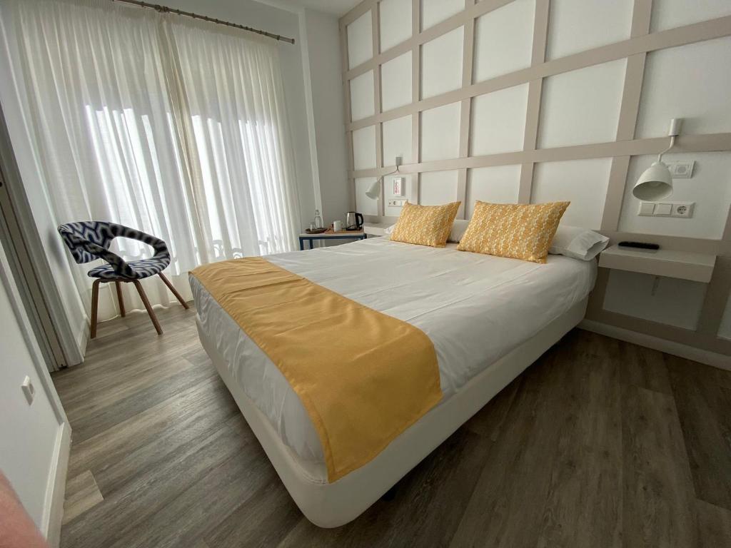 Łóżko lub łóżka w pokoju w obiekcie Hotel Boutique Teatro Romano