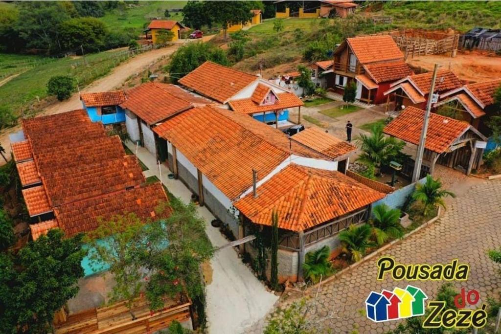 an overhead view of a group of houses with orange roofs at Pousada do Zezé in Bueno Brandão