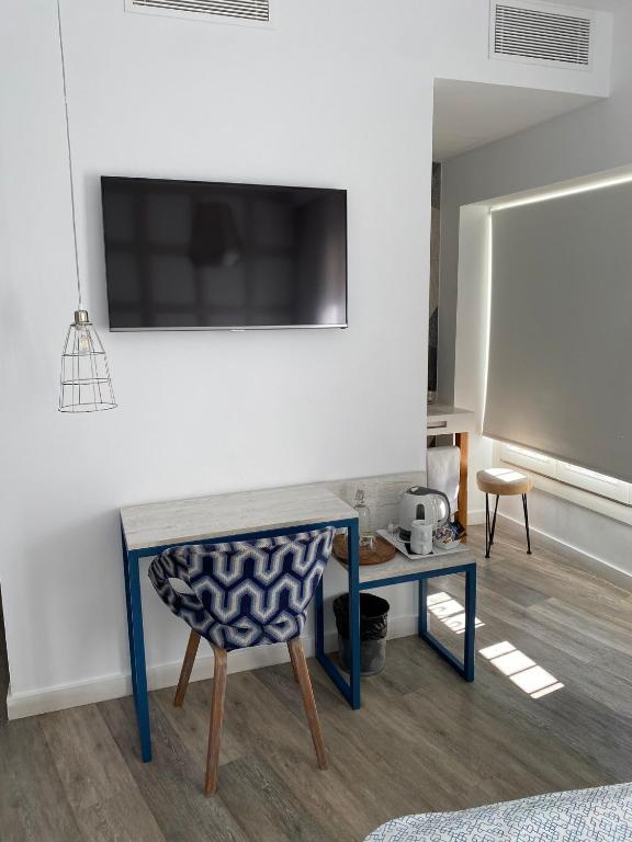 Telewizja i/lub zestaw kina domowego w obiekcie Hotel Boutique Teatro Romano