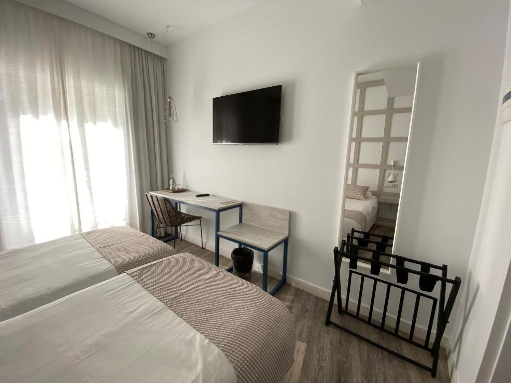 Łóżko lub łóżka w pokoju w obiekcie Hotel Boutique Teatro Romano
