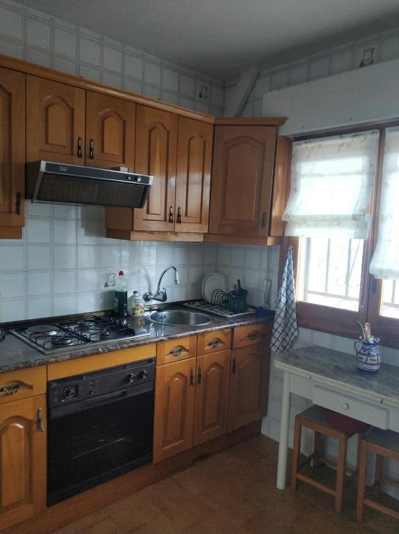 Kuchyň nebo kuchyňský kout v ubytování La lechuza blanca